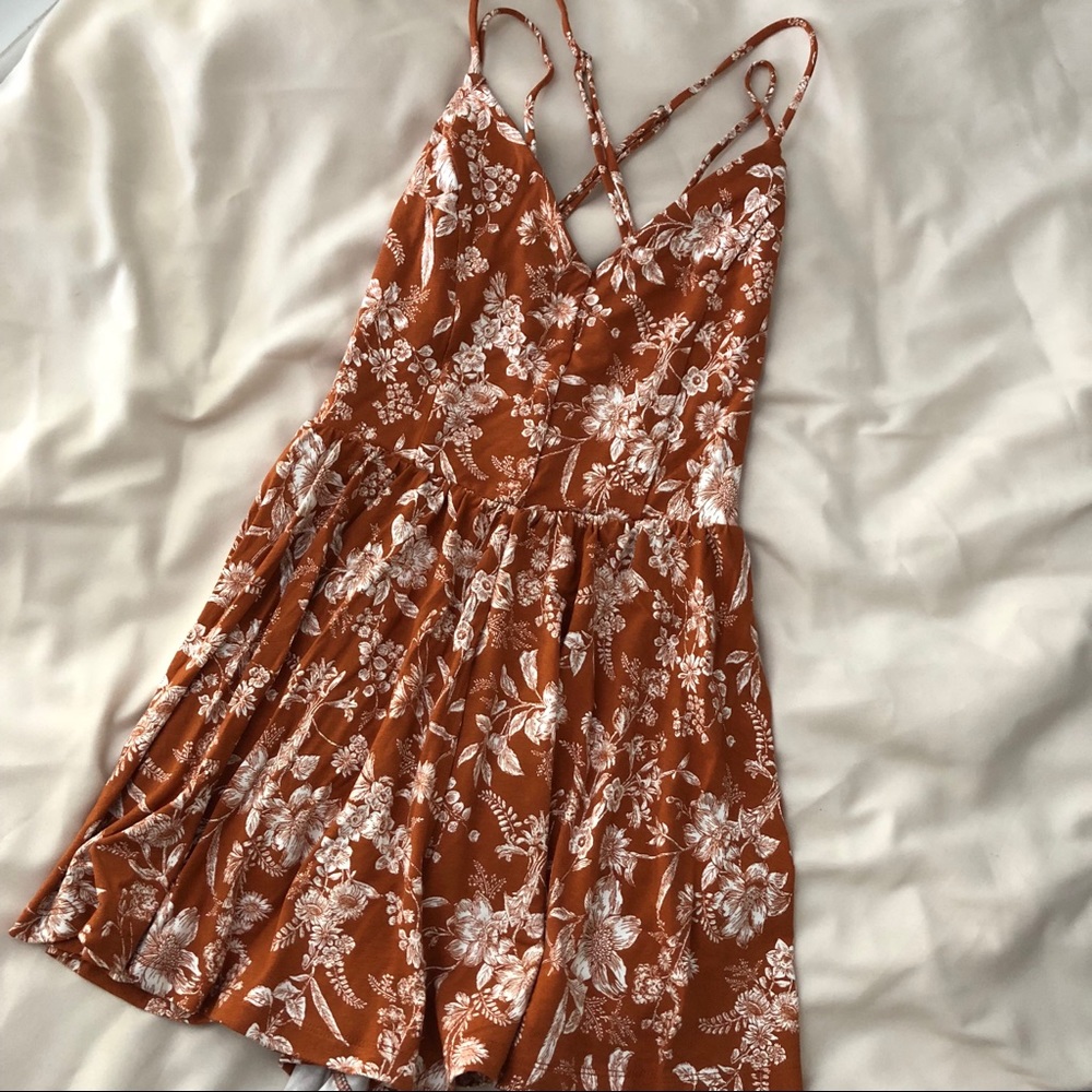 Forever 21 floral romper with detailed back.